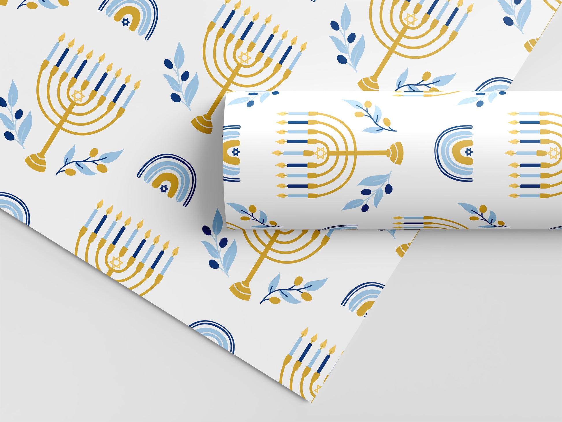 Hanukkah wrapping paper with gold menorahs, blue candles, olive branches, and Stars of David on white.