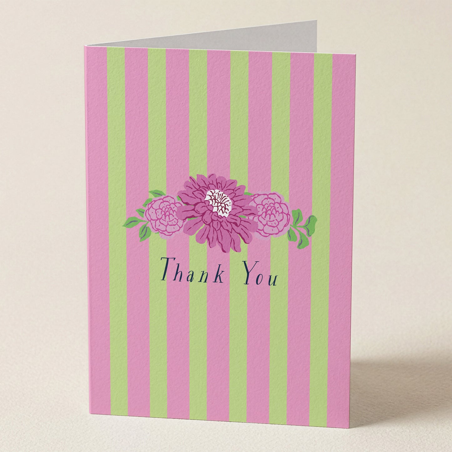 Greeting card with pink and green stripes and purple flowers with 'Thank You' text.