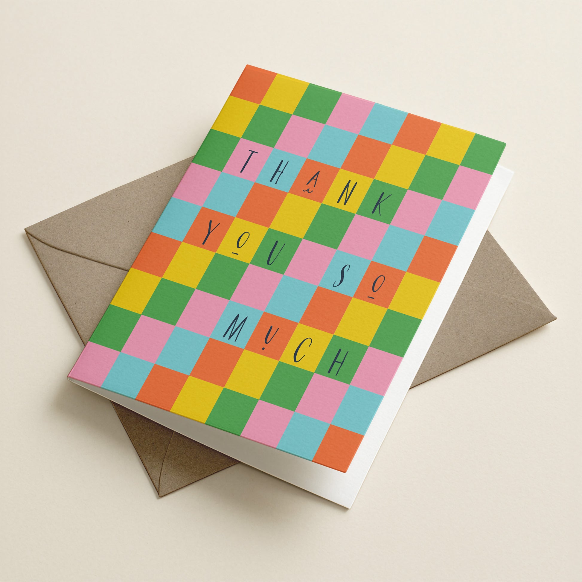 Colorful checkered card with 'Thank you so much' text on a beige background